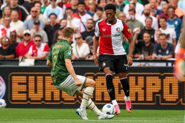 2026-08-16 Feyenoord v Go Ahead Eagles - Dutch Eredivisie ROTTERDAM, NETHERLANDS - AUGUST 16: Gaoussou Diarra of Feyenoord is challenged by Alfons Sampsted of Go Ahead Eagles during the Dutch Eredivisie match between Feyenoord and Go Ahead Eagles at Stadion Feijenoord on August 16, 2026 in Rotterdam, Netherlands. Rotterdam Stadion Feijenoord Netherlands Content not available for redistribution in The Netherlands directly or indirectly through any third parties. Copyright: xHansxvanxderxValkx