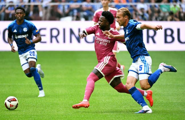 Gelsenkirchen, Germany, 1. Bundesliga, Friendly Match, Veltins Arena Gelsenkirchen, FC Schalke 04 - Real Madrid; Vinicius Junior (RMA), Timo Becker (S04). Action *** Gelsenkirchen, Germany, Bundesliga 1, Friendly Match, Veltins Arena Gelsenkirchen, FC Schalke 04 vs. Real Madrid, Vinicius Junior (RMA), Timo Becker (S04), Action