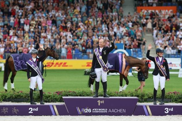 Siegerehrung Einzel, 1. Patz, Weltmeister, Michael Jung (GER, Deutschland, Germany), Pferd fischerChipmunk FRH, Chipmunk FRH, 2. Platz Rosalind Canter (GBR, Grossbritanien, Great Britain) Pferd Lordships Graffalo, Laura Collett (GBR, Grossbritanien, Great Britain) mit Pferd London 52, Vielseitigkeit , FEI Eventing World Championship, WM, Weltmeisterschaft , DHL-Preis, Einzel Mannschaft, AACHEN - FEI World Championships 2026, Weltfest des Pferdesports, Reitsport Weltmeisterschaft 2026, Aachen 2026, Welcome Home 2026, Aachener Soers, 11. bis 23. August 2026, Reitsport, 16.08.2026, Aachen Aachener Soers Deutschland *** Individual Medal Ceremony, 1st Place, World Champion, Michael Jung GER, Germany, Horse: fischerChipmunk FRH, Chipmunk FRH; 2nd Place: Rosalind Canter GBR, Great Britain, Horse: Lordships Graffalo, Laura Collett GBR, Great Britain, riding London 52, Eventing, FEI Eventing World Championship, DHL Prize, Individual and Team Events, AACHEN FEI World Championships 2026, World Festival of Equestrian Sports, 2026 Equestrian World Championships, Aachen 2026, Welcome Home 2026, Aachen Soers, August 11–23, 2026, Equestrian Sports, August 16, 2026, Aachen Soers, Germany