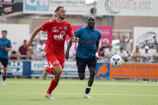 KERZERS, FRIBOURG, SWITZERLAND - AUGUST 16: Enea Rostetter of FC Kerzers challenges Josias Lukembila of FC Sion during the Swiss Cup first round match between FC Kerzers and FC Sion at Stadion Erli on August 16, 2026 in Kerzers, Fribourg, Switzerland.  Copyright: xLivioxBaeriswylx xSPPx Sportspressphoto_SPR209020
