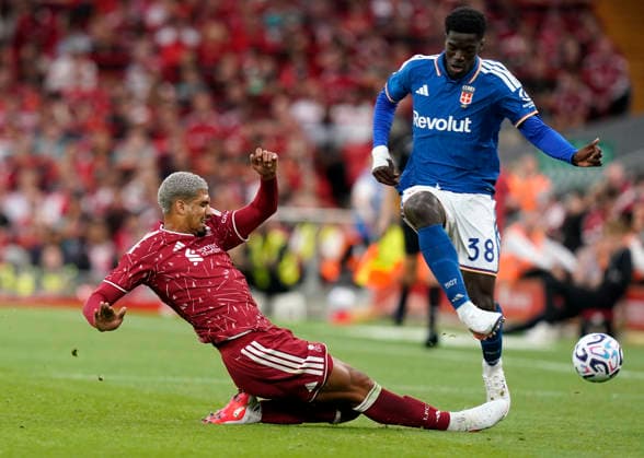 Liverpool, England, 16th August 2026. Ronald Araujo of Liverpool (L) challenges Assane Diao of Como during the Liverpool vs Como 1907 Pre Season Friendly match at Anfield, Liverpool. Picture credit should read: Andrew Yates Sportimage EDITORIAL USE ONLY. No use with unauthorised audio, video, data, fixture lists, club league logos or live services. Online in-match use limited to 120 images, no video emulation. No use in betting, games or single club league player publications. SPI_020_AY_LIVERPOOL_COMO SPI-4910-0018
