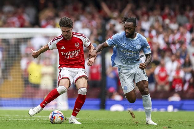 CARDIFF, WALES, AUG 16: Antoine Semenyo of Manchester City and Declan Rice of Arsenal fight for possession during the FA Community Shield match between Arsenal and Manchester City at the Millennium Stadium in Cardiff, Wales on 16th of August (photo by Qian Jun Sports Press Photo)  Copyright: xQianxJun SportsxPressxPhotox Sportspressphoto_SPR209555