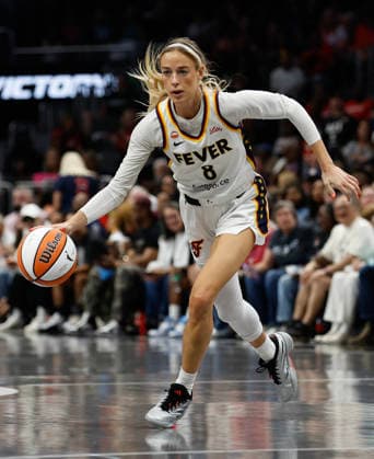 Guard Sophie Cunningham 8 of the Indiana Fever dribbles against the Atlanta Dream at State Farm Arena on Sunday, August 16, 2026 in Atlanta, Georgia.  ATL20260816104 MikexZarrilli