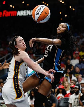 Forward Angel Reese 5 of the Atlanta Dream passes around guard Caitlin Clark 8 of the Indiana Fever in the second half at State Farm Arena on Sunday, August 16, 2026 in Atlanta, Georgia.  ATL20260816113 MikexZarrilli
