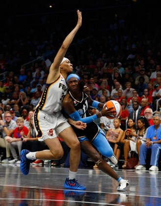 Forward Makayla Timpson 21 of the Indiana Fever collides with guard Jaylyn Sherrod 4 of the Atlanta Dream in the second half at State Farm Arena on Sunday, August 16, 2026 in Atlanta, Georgia.  ATL20260816127 MikexZarrilli