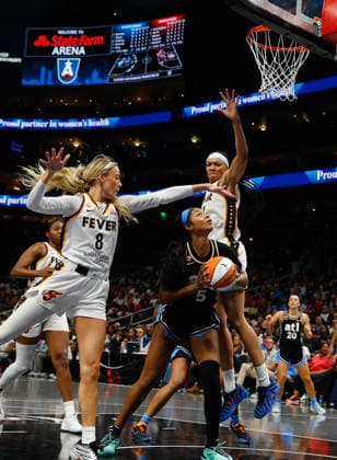Guard Sophie Cunningham 8 (left) and forward Makayla Timpson 21 (right) of the Indiana Fever defend forward Angel Reese 5 of the Atlanta Dream in the second half at State Farm Arena on Sunday, August 16, 2026 in Atlanta, Georgia.  ATL20260816128 MikexZarrilli