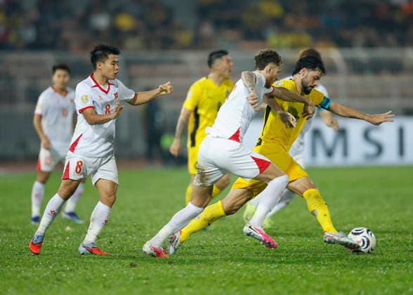 August 16, 2026, Kuala Lumpur, Malaysia: Sturmer Dos Reis Paulo Josue of Malaysia and Tai Loc Nguyen of Vietnam (C) seen in action during the ASEAN Hyundai Cup 2026 First-Leg Semi-Final match between Malaysia and Vietnam at Kuala Lumpur Football Stadium. Final score; Malaysia 0:2 Vietnam Kuala Lumpur Malaysia - ZUMAs197 20260816_aaa_s197_307 Copyright: xWongxFokxLoyx