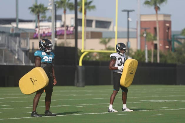 JACKSONVILLE, FL - AUGUST 17: Jacksonville Jaguars running back J Mari Taylor (30) and Jacksonville Jaguars safety Trevian Thomas (34) work on a drill during training camp on August 17, 2026 at the Miller Electric Center in Jacksonville, Fl. (Photo by David Rosenblum Icon Sportswire) NFL, American Football Herren, USA AUG 17 Jaguars Training Camp EDITORIAL USE ONLY Icon260817237997