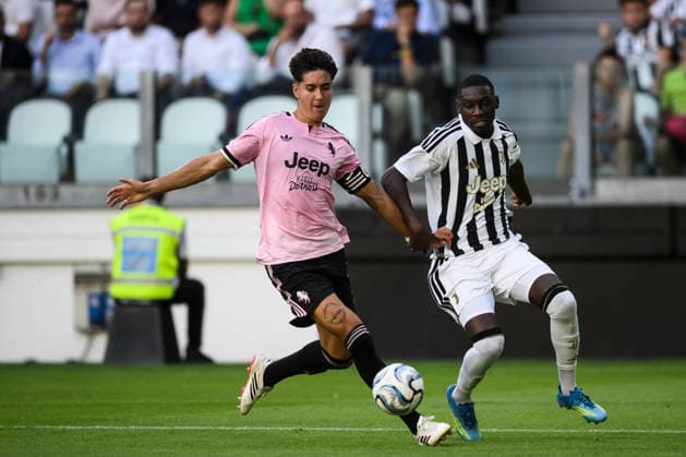 Juventus FC v Juventus Next Gen - Friendly Randal Kolo Muani of Juventus FC competes for teh ball with Javier Gil Puche of Juventus Next Gen during the friendly football match between Juventus FC and Juventus Next Gen. Turin Italy Copyright: xNicolòxCampox