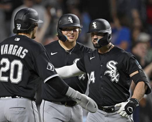 Baseball: White Sox vs. Cubs Chicago White Sox designated hitter Randal Grichuk (R) is greeted by teammates Munetaka Murakami (C) and Miguel Vargas (20) after hitting a three-run home run during the fourth inning of a baseball game against the Chicago Cubs at Wrigley Field in Chicago on Aug. 17, 2026.  A14AA0005626177P