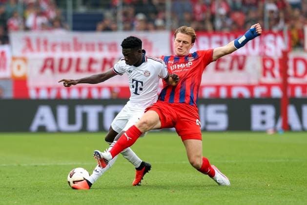 im Zweikampf, Aktion, mit Bara Ndiaye 39 (FC Bayern Muenchen), Mikkel Kaufmann 29 (1. FC Heidenheim), 1. FC Heidenheim 1846 vs. FC Bayern Muenchen, Fussball, Testspiel, 18.08.2026 Heidenheim Baden-Wuerttemberg Deutschland *** One-on-one, action, with Bara Ndiaye 39 FC Bayern Munich, Mikkel Kaufmann 29, 1 FC Heidenheim, 1 FC Heidenheim 1846 vs. FC Bayern Munich, soccer, friendly match, August 18, 2026, Heidenheim, Baden-Württemberg, Germany Copyright: xkolbert-press ChristianxKolbertx