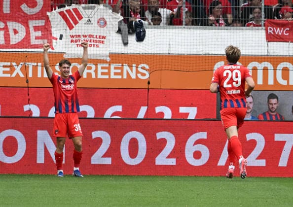 18.08.2026, xsltx, Fussball Testspiel, 1.FC Heidenheim - FC Bayern München v.l. Yannik Wagner (1. FC Heidenheim 1846) trifft zum 1:0, erster Gratulant ist Mikkel Kaufmann (1. FC Heidenheim 1846) (DFL DFB REGULATIONS PROHIBIT ANY USE OF PHOTOGRAPHS as IMAGE SEQUENCES and or QUASI-VIDEO) *** August 18, 2026, xsltx, soccer friendly, 1 FC Heidenheim vs. FC Bayern Munich – Yannik Wagner of 1 FC Heidenheim 1846 scores to make it 1–0, the first to congratulate him is Mikkel Kaufmann, 1 FC Heidenheim 1846. DFL and DFB regulations prohibit any use of photographs as image sequences and or quasi-video.