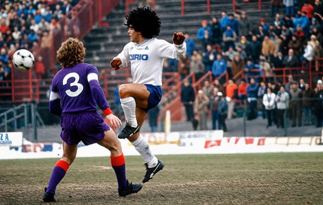 Soccer - Italian Serie A - A.C. Fiorentina vs Napoli, S.S.C FLORENCE, ITALY - JANUARY 13: Renzo Contratto, A.C. Fiorentina and Diego Armando Maradona Napoli, S.S.C during a Serie A match between A.C. Fiorentina and Napoli, S.S.C at Municipal Stadium on January 13, 1985 in Florence, Italy. 13 January 1985 Florence Tuscany Italy Copyright: xStefanoxMontesix