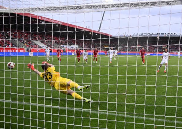 18.08.2026, xsltx, Fussball Testspiel, 1.FC Heidenheim - FC Bayern München v.l. Thomas Dähne (1. FC Heidenheim 1846) kann das 2:2 per Strafstoß von Arijon Ibrahimovic (FC Bayern München) nicht verhindern (DFL DFB REGULATIONS PROHIBIT ANY USE OF PHOTOGRAPHS as IMAGE SEQUENCES and or QUASI-VIDEO) *** August 18, 2026, xsltx, soccer exhibition match, 1 FC Heidenheim vs. FC Bayern Munich – Thomas Dähne, 1 FC Heidenheim 1846, cannot prevent the 2–2 draw due to a penalty kick by Arijon Ibrahimovic of FC Bayern Munich. DFL and DFB regulations prohibit any use of photographs as image sequences and or QUASI-VIDEO