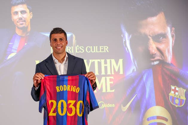 Rodri officially presented as Barcelona player BARCELONA, SPAIN - AUGUST 18: Rodrigo Hernandez Rodri of FC Barcelona, Barca poses with an FC Barcelona shirt bearing his name and the year 2030 during his official presentation as an FC Barcelona player at Spotify Camp Nou on August 18, 2026, in Barcelona, Spain. Adria Puig Anadolu Barcelona Spain. Editorial use only. Please get in touch for any other usage.  Copyright: x2026xAnadoluxAdriaxPuigx