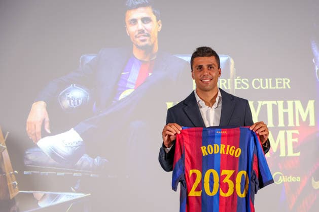 Rodri officially presented as Barcelona player BARCELONA, SPAIN - AUGUST 18: Rodrigo Hernandez Rodri of FC Barcelona, Barca poses with an FC Barcelona shirt bearing his name and the year 2030 during his official presentation as an FC Barcelona player at Spotify Camp Nou on August 18, 2026, in Barcelona, Spain. Adria Puig Anadolu Barcelona Spain. Editorial use only. Please get in touch for any other usage.  Copyright: x2026xAnadoluxAdriaxPuigx