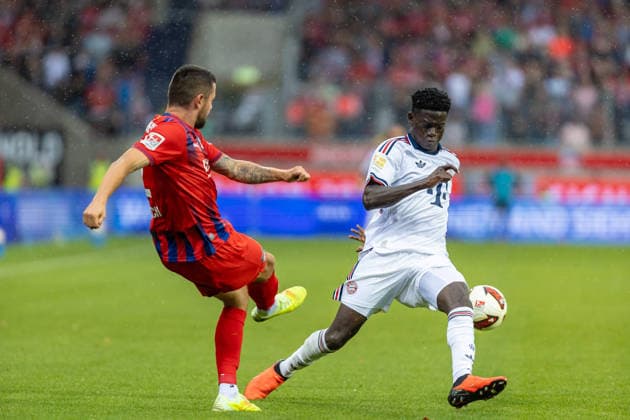Bara Sapoko Ndiaye (FC Bayern Muenchen, 39) blockt Ball von Marnon Busch (1.FC Heidenheim, 02) Mimik, GER, 1. FC Heidenheim vs. FC Bayern Muenchen, Fußball, Testspiel, 2026 2027, 18.08.2026, DFL DFB REGULATIONS PROHIBIT ANY USE OF PHOTOGRAPHS AS IMAGE SEQUENCES AND OR QUASI-VIDEO, GER, 1. FC Heidenheim vs. FC Bayern Muenchen, Fußball, Testspiel, 2026 2027, 18.08.2026 Heidenheim *** Bara Sapoko Ndiaye, FC Bayern Munich, 39, blocks a shot by Marnon Busch, 1, FC Heidenheim, 02, facial expression, GER, 1 FC Heidenheim vs. FC Bayern Munich, soccer, friendly match, 2026–2027, August 18, 2026, DFL DFB regulations prohibit any use of photographs as image sequences and or quasi-video, GER, 1 FC Heidenheim vs. FC Bayern Munich, Soccer, Friendly Match, 2026–2027, August 18, 2026, Heidenheim Copyright: xEibner-Pressefoto JanixPlessx EP_JPL
