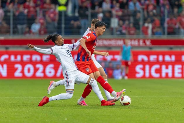 Harter Zweikampf Michael Olise (FC Bayern Muenchen, 17) Mathias Honsak (1.FC Heidenheim, 17), GER, 1. FC Heidenheim vs. FC Bayern Muenchen, Fußball, Testspiel, 2026 2027, 18.08.2026, DFL DFB REGULATIONS PROHIBIT ANY USE OF PHOTOGRAPHS AS IMAGE SEQUENCES AND OR QUASI-VIDEO, GER, 1. FC Heidenheim vs. FC Bayern Muenchen, Fußball, Testspiel, 2026 2027, 18.08.2026 Heidenheim *** Fierce Tackle: Michael Olise (FC Bayern Munich), 17; Mathias Honsak (1 FC Heidenheim), 17, GER, 1 FC Heidenheim vs. FC Bayern Munich, Soccer, Friendly Match, 2026–2027, August 18, 2026, DFL and DFB regulations prohibit any use of photographs as image sequences and or quasi-video, GER, 1 FC Heidenheim vs. FC Bayern Munich, soccer, friendly match, 2026–2027, August 18, 2026, Heidenheim Copyright: xEibner-Pressefoto JanixPlessx EP_JPL