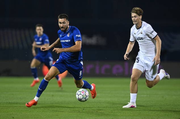 GNK Dinamo Zagreb v Viking - UEFA Champions League 2026 27 Play-Offs First Leg Dion Drena Beljo of GNK Dinamo Zagreb and Henrik Falchener of Viking battles for the ball during the UEFA Champions League 2026 27 play-offs first leg match between GNK Dinamo Zagreb and Viking at Maksimir Stadium on August 18, 2026 in Zagreb, Croatia.  MarkoxLukunic PIXSELL