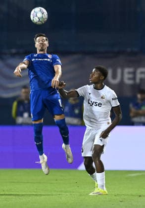 GNK Dinamo Zagreb v Viking - UEFA Champions League 2026 27 Play-Offs First Leg Miha Zajc of GNK Dinamo Zagreb jumps for the ball whilst under pressure from Tobias Moi during the UEFA Champions League 2026 27 play-offs first leg match between GNK Dinamo Zagreb and Viking at Maksimir Stadium on August 18, 2026 in Zagreb, Croatia.  MarkoxLukunic PIXSELL