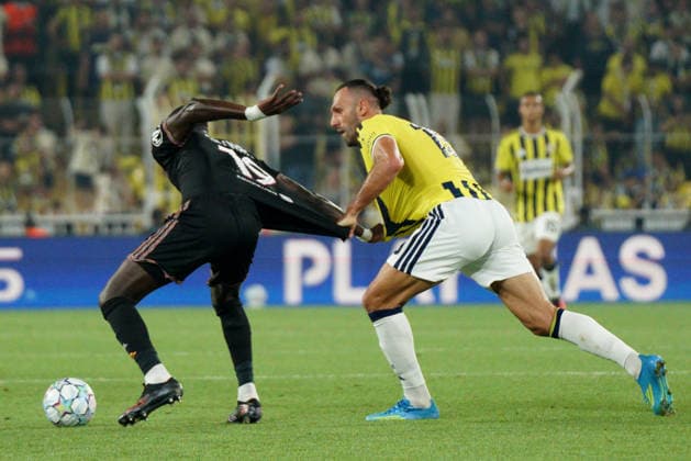 August 18, 2026, Kadikoy, Istanbul, Turkey: Vedat Muriqi (R) of Fenerbahce in action against Moussa Niakhate (L) of Olympique Lyonnais during the UEFA Champions League play-off round match between Fenerbahce and Olympique Lyonnais at the Chobani Stadium, Fenerbahce Sukru Saracoglu Sports Complex in Istanbul, Turkey, on August 18, 2026. Kadikoy Turkey - ZUMAu194 20260818_zip_u194_017 Copyright: xTolgaxUluturkx