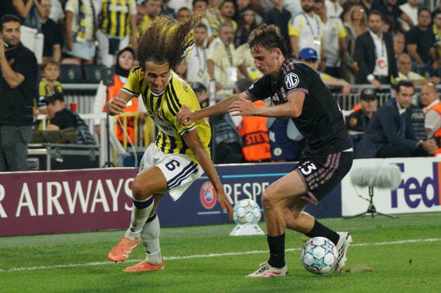 August 18, 2026, Kadikoy, Istanbul, Turkey: Matteo Guendouzi (L) of Fenerbahce in action against Tyler Morton (R) Olympique Lyonnais during the UEFA Champions League play-off round match between Fenerbahce and Olympique Lyonnais at the Chobani Stadium, Fenerbahce Sukru Saracoglu Sports Complex in Istanbul, Turkey, on August 18, 2026. UEFA Champions League Play-Offs: Fenerbahce Vs Olympique Lyonnais  - ZUMAu194 20260818_zip_u194_022 Copyright: xTolgaxUluturkx