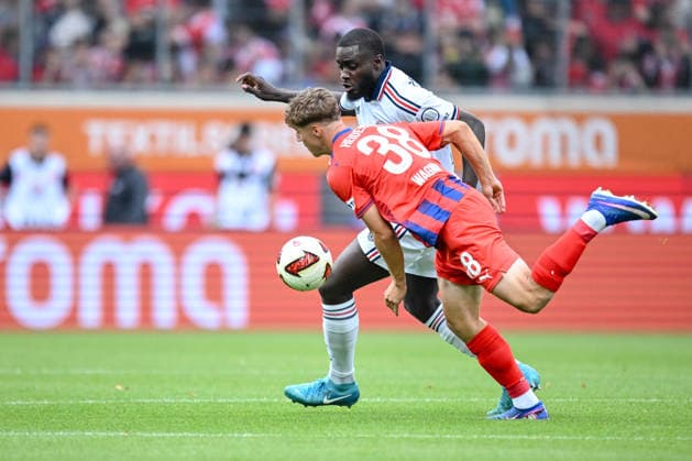 Yannik Wagner (1. FC Heidenheim 1846) and Dayot Upamecano (FC Bayern Muenchen) battle for the ball during the pre-Season Friendly match between 1.FC Heidenheim v FC Bayern Muenchen at Voith-Arena on August 18, 2026 in Heidenheim, Germany. (Photo by Harry Langer DeFodi Images) - *** Yannik Wagner of 1. FC Heidenheim 1846 and Dayot Upamecano of FC Bayern Munich battle for the ball during the preseason friendly match between 1. FC Heidenheim and FC Bayern Munich at the Voith Arena on August 18, 2026 in Heidenheim, Germany. Photo by Harry Langer, DeFodi Images