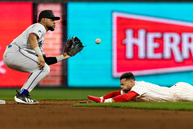 Philadelphia Phillies Justin Crawford slides safe into second before Miami Marlins shortstop Otto Lopez can make the tag in the fifth inning of a baseball game, Tuesday, Aug. 18, 2026, in Philadelphia, Pennsylvania.  PHI20260818013 LaurencexKesterson