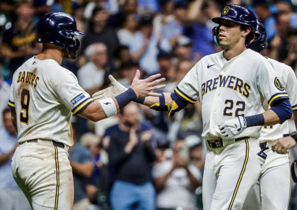 Milwaukee Brewers designated hitter Christian Yelich (R) celebrates with Milwaukee Brewers first baseman Jake Bauers (L) after hitting a three RBI home run in the fifth inning of the MLB, Baseball Herren, USA game between the Seattle Mariners and the Milwaukee Brewers at American Family Field in Milwaukee, Wisconsin on Tuesday, August 18, 2026.  MIL20260818821 TANNENxMAURY
