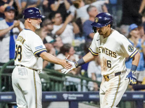 Milwaukee Brewers third baseman David Hamilton celebrates with Milwaukee Brewers third base coach Matt Erickson after hitting a three RBI homne run in the sixth inning of the MLB, Baseball Herren, USA game between the Seattle Mariners and the Milwaukee Brewers at American Family Field in Milwaukee, Wisconsin on Tuesday, August 18, 2026.  MIL20260818827 TANNENxMAURY
