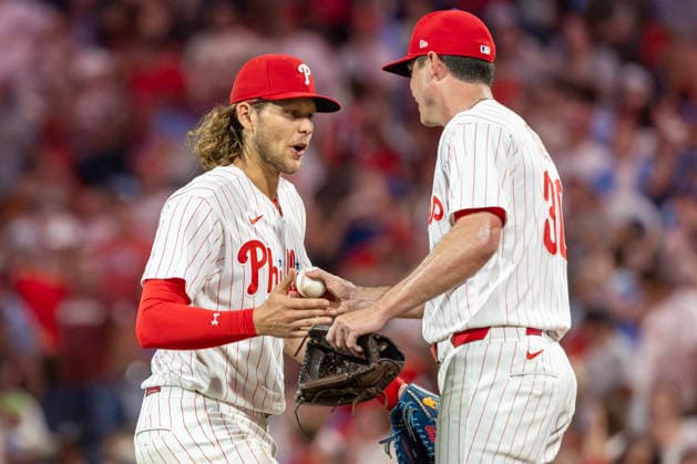 Philadelphia Phillies third baseman Alec Bohm gives the game ball to closing pitcher Brooks Raley, right, after their team defeated the Miami Marlins in a baseball game Tuesday, August 18, 2026, in Philadelphia, Pennsylvania.  PHI20260818019 LaurencexKesterson