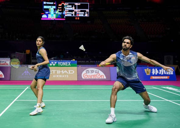 BWF World Championships 2026: India vs Macau New Delhi, Aug 19 (ANI): India s Dhruv Kapila and Tanisha Crasto in action against Macau s Leong Iok Chong and Weng Chi Ng during the mixed doubles match at the BWF World Championships 2026 at Indira Gandhi Indoor Stadium, in New Delhi on Wednesday. New Delhi Delhi India Copyright: xANIx ANI_20260819073