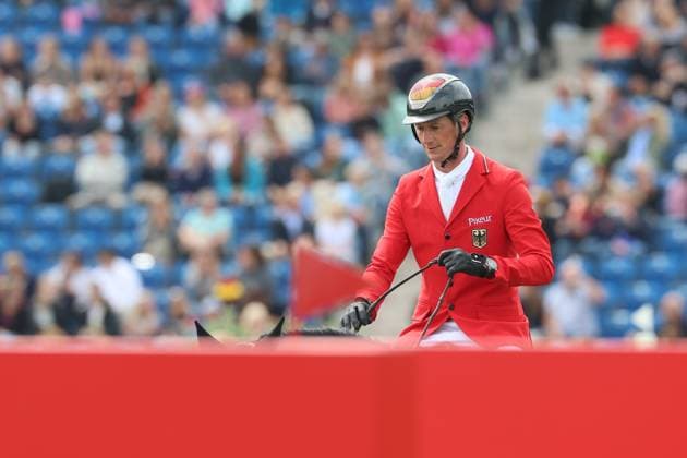 Daniel Deusser (GER, Deutschland, Germany) mit Pferd Otello de Guldenboom, 3 deutscher Teamreiter mit 0 Fehler und guter Zeit, Springen, FEI Jumping World Championship, WM, Weltmeisterschaft , Turkish Airlines-Prize, Einzel und Teamwertung, Jumping , AACHEN - FEI World Championships 2026, Weltfest des Pferdesports, Reitsport Weltmeisterschaft 2026, Aachen 2026, Welcome Home 2026, Aachener Soers, 11. bis 23. August 2026, Reitsport, 19.08.2026, Aachen Aachener Soers Deutschland *** Daniel Deusser GER, Germany, riding Otello de Guldenboom, one of three German team riders with a clear round and a good time, show jumping, FEI Jumping World Championship, Turkish Airlines Prize, individual and team standings, show jumping, AACHEN FEI World Championships 2026, World Equestrian Festival, 2026 World Equestrian Championships, Aachen 2026, Welcome Home 2026, Aachen Soers, August 11–23, 2026, Equestrian Sports, August 19, 2026, Aachen Soers, Germany