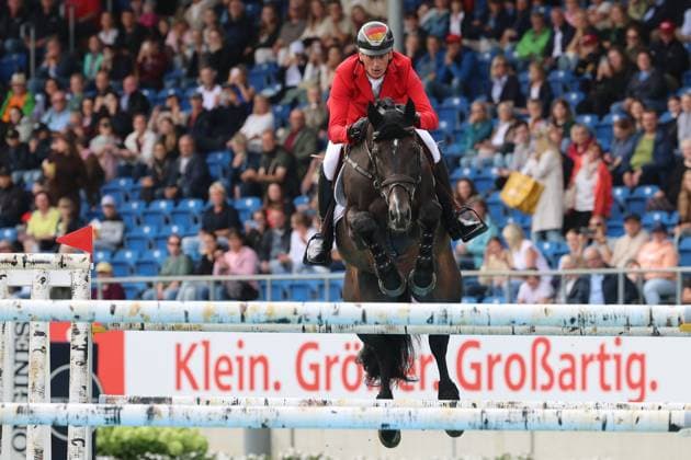 Daniel Deusser (GER, Deutschland, Germany) mit Pferd Otello de Guldenboom, 3 deutscher Teamreiter mit 0 Fehler und guter Zeit, Springen, FEI Jumping World Championship, WM, Weltmeisterschaft , Turkish Airlines-Prize, Einzel und Teamwertung, Jumping , AACHEN - FEI World Championships 2026, Weltfest des Pferdesports, Reitsport Weltmeisterschaft 2026, Aachen 2026, Welcome Home 2026, Aachener Soers, 11. bis 23. August 2026, Reitsport, 19.08.2026, Aachen Aachener Soers Deutschland *** Daniel Deusser GER, Germany, riding Otello de Guldenboom, one of three German team riders with a clear round and a good time, show jumping, FEI Jumping World Championship, Turkish Airlines Prize, individual and team standings, show jumping, AACHEN FEI World Championships 2026, World Equestrian Festival, 2026 World Equestrian Championships, Aachen 2026, Welcome Home 2026, Aachen Soers, August 11–23, 2026, Equestrian Sports, August 19, 2026, Aachen Soers, Germany