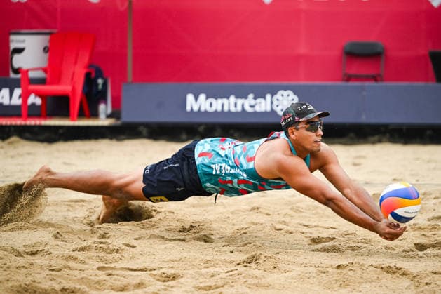 MONTREAL, QC - AUGUST 19: Renato Andrew Lima de Carvalho (BRA) plunges to bump the ball during a qualification match at Beach Pro Tour Montreal Elite 16 on August 19, 2026 at Parc Jean-Drapeau in Montreal, QC (Photo by David Kirouac Icon Sportswire) VOLLEYBALL: AUG 19 Beach Pro Tour Montreal Elite 16 EDITORIAL USE ONLY Icon26081901126