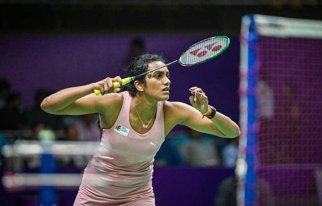NEW DELHI, INDIA - AUGUST 19: India™s Pusarla V. Sindhu returns a shot against Canada™s Wen Yu Zhang during their women™s singles Round of 32 match on day three of the BWF World Championships 2026 at the Indira Gandhi Indoor Stadium on August 19, 2026 in New Delhi, India. (Photo by Sanchit Khanna Hindustan Times) BWF World Championships 2026