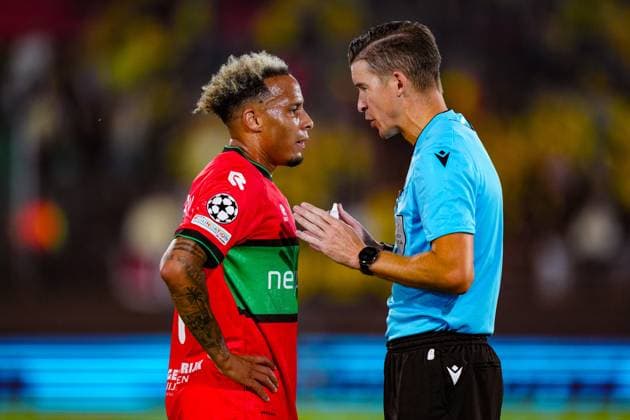 NIJMEGEN , 19-08-2026 , Stadium De Goffert , season 2026 2027 , UEFA Champions League play-offs 1st leg football , match between NEC Nijmegen and Bodo Glimt , picture shows NEC player Tjaronn Chery and Referee Francois Letexier NEC - Bodo Glimt  x205853583x Copyright: