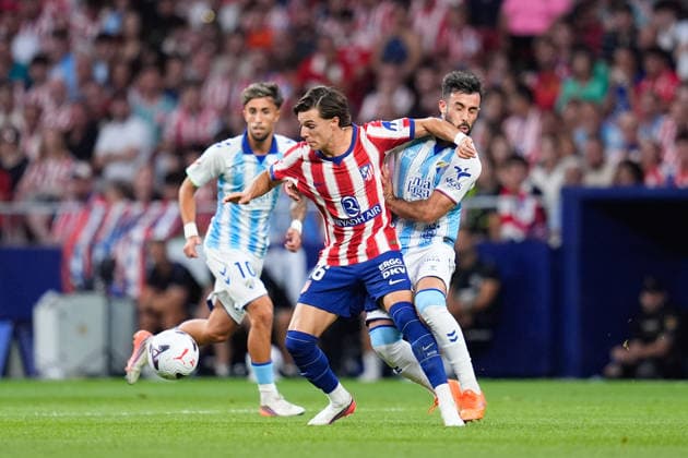 August 19, 2026, Madrid, Madrid, Spain: Arnau Ortiz of Atletico de Madrid and Carlos Puga of Malaga CF compete for the ball during the Spanish League, LaLiga EA Sports, football match played between Atletico de Madrid and Malaga CF at Riyadh Air Metropolitano stadium on August 19, 2026, in Madrid, Spain. Atletico De Madrid V Malaga CF - LaLiga EA Sports  - ZUMAa181 20260819_zaa_a181_078 Copyright: xDennisxAgyemanx