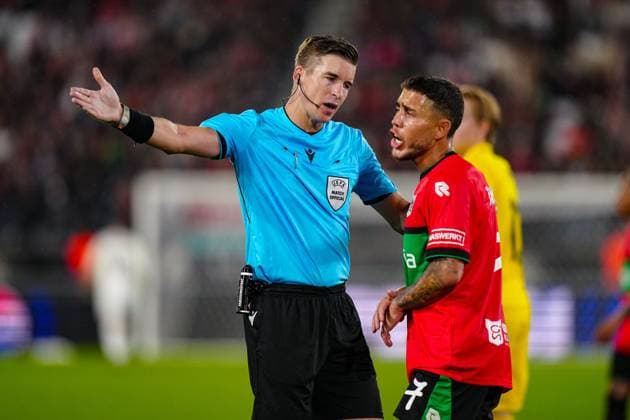 NIJMEGEN , 19-08-2026 , Stadium De Goffert , season 2026 2027 , UEFA Champions League play-offs 1st leg football , match between NEC Nijmegen and Bodo Glimt , picture shows Referee Francois Letexier and NEC player Emre Mor NEC - Bodo Glimt  x205854665x Copyright: