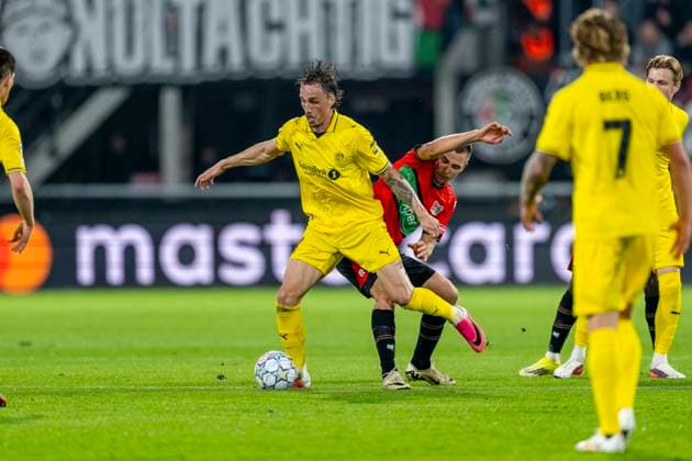 NIJMEGEN - L-R FC Bodo Glimt aanvaller Andreas Helmersen en N.E.C. Nijmegen middenvelder Darko Nejasmic tijdens de UEFA Champions League wedstrijd tussen N.E.C. en FC Bodo Glimt in Gofferpark op 19 augustus 2026 in Nijmegen, Nederland. - *** NIJMEGEN: FC Bodo Glimt forward Andreas Helmersen and NEC Nijmegen midfielder Darko Nejasmic during the UEFA Champions League match between NEC and FC Bodo Glimt at Gofferpark on August 19, 2026, in Nijmegen, the Netherlands