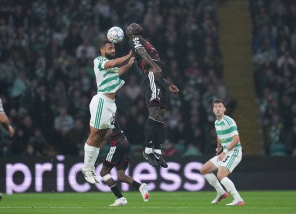 Cameron Carter-Vickers of Celtic beats Samuel Adeniran of LASK in the air. Celtic v LASK, UEFA Champions League, Play Off Round, First Leg, Football, Celtic Park, Glasgow, Scotland, UK - 19 Aug 2026Glasgow Celtic Park United Kingdom  Copyright: xStuartxWallace Shutterstockx 17104271bt