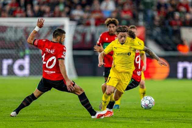 NIJMEGEN - L-R N.E.C. Nijmegen aanvaller Dusan Tadic en FC Bodo Glimt middenvelder Patrick Berg tijdens de UEFA Champions League wedstrijd tussen N.E.C. en FC Bodo Glimt in Gofferpark op 19 augustus 2026 in Nijmegen, Nederland. - *** NIJMEGEN L R N E C Nijmegen forward Dusan Tadic and FC Bodo Glimt midfielder Patrick Berg during the UEFA Champions League match between N E C and FC Bodo Glimt at Gofferpark on August 19, 2026, in Nijmegen, the Netherlands