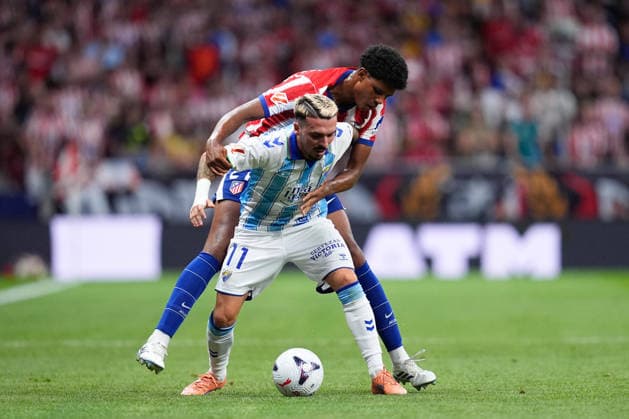 August 19, 2026, Madrid, Madrid, Spain: Joaquin Munoz of Malaga CF and Jorge Dominguez of Atletico de Madrid compete for the ball during the Spanish League, LaLiga EA Sports, football match played between Atletico de Madrid and Malaga CF at Riyadh Air Metropolitano stadium on August 19, 2026, in Madrid, Spain. Madrid Spain - ZUMAa181 20260819_zaa_a181_082 Copyright: xDennisxAgyemanx