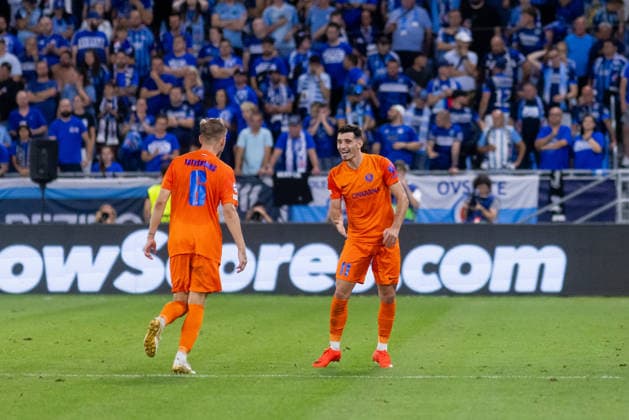 Artemijus Tutyskinas of Celje and Milot Avdyli of Celje seen during UEFA Champions league first play-off game between teams of SK Slovan Bratislava and Celje (Dominika Kortvelyesiova Ball Raw Images) Bratislava Tehelne Pole stadium Slovakia Copyright: xDominikaxKortvelyesiovax DKOR1914