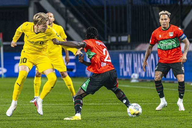 NIJMEGEN - Jens Petter Hauge of FK Bodo Glimt battles for possession with Brayann Pereira of NEC Nijmegen during the UEFA Champions League Play-offs match between NEC Nijmegen and FK Bodo Glimt at the Goffertstadion on 19 August 2026 in Nijmegen, the Netherlands. KEVIN SENDERS ANP xVIxANPxSportx xMarcelxterxBalsxIVx 565833893 originalFilename: 565833893.jpg