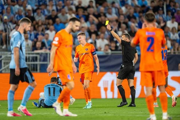 A Yellow card for Mark Zabukovnik during Champions League qualifying playoff match, SK Slovan Bratislava - NK Celje , 19. august 2026, Tehelne pole Stadium, Bratislava, Slovakia Copyright: xMICHALxFAJT,ZOSPORTU.SKx MAR_8429