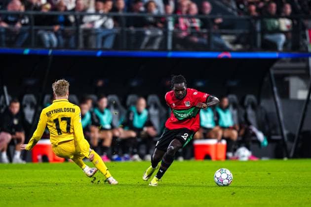 NIJMEGEN , 19-08-2026 , Stadium De Goffert , season 2026 2027 , UEFA Champions League play-offs 1st leg football , match between NEC Nijmegen and Bodo Glimt , picture shows NEC player Brayann Pereira and Bodo Glimt player Qla Brynhildsen NEC - Bodo Glimt  x205855612x Copyright: