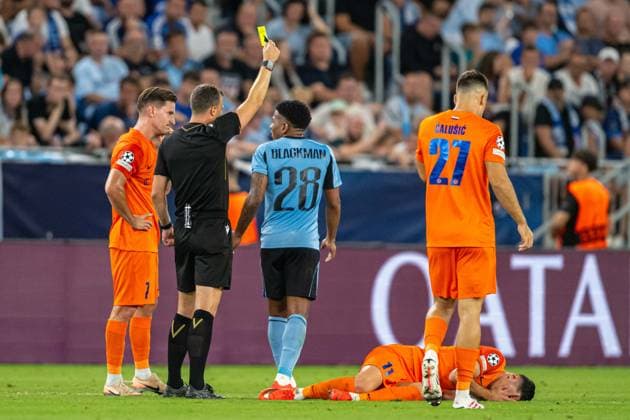 Referee show a yellow card to Cesar Blackman during Champions League qualifying playoff match, SK Slovan Bratislava - NK Celje , 19. august 2026, Tehelne pole Stadium, Bratislava, Slovakia Copyright: xMICHALxFAJT,ZOSPORTU.SKx MAR_8728-2
