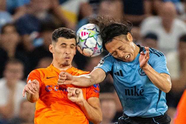 Milot Avdyli header battle with Daiki Matsuoka during Champions League qualifying playoff match, SK Slovan Bratislava - NK Celje , 19. august 2026, Tehelne pole Stadium, Bratislava, Slovakia Copyright: xMICHALxFAJT,ZOSPORTU.SKx MAR_8742