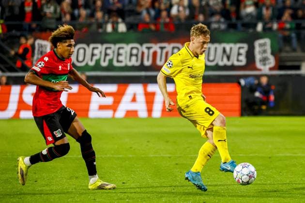 NIJMEGEN - Sondre Auklend of FK Bodo Glimt dribbles with the ball under pressure from Noe Lebreton of NEC Nijmegen during the UEFA Champions League Play-offs match between NEC Nijmegen and FK Bodo Glimt at the Goffertstadion on 19 August 2026 in Nijmegen, the Netherlands. WART BRINKERHOF ANP xVIxANPxSportx xMarcelxterxBalsxIVx 565836720 originalFilename: 565836720.jpg